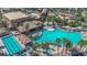 Bird's-eye view of a luxurious community pool area, showcasing various pools, seating areas, and tropical landscaping at 508 Via Palermo Dr, Henderson, NV 89011