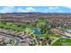 Picturesque aerial view of a community with a golf course and pond, showcasing beautiful landscaping and community design at 508 Via Palermo Dr, Henderson, NV 89011