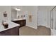 Modern bathroom with dual sinks, a large mirror, and a glass enclosed walk-in shower at 508 Via Palermo Dr, Henderson, NV 89011