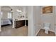 Bathroom with a toilet and vanity area; bedroom visible in background through archway at 508 Via Palermo Dr, Henderson, NV 89011