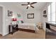 Comfortable bedroom with a ceiling fan, natural light, and a TV with plenty of closet space at 508 Via Palermo Dr, Henderson, NV 89011