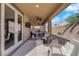 This covered patio features ceiling fans, and ample seating for lounging or entertaining at 508 Via Palermo Dr, Henderson, NV 89011