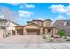 Charming two-story home featuring a three-car garage, desert landscaping and a welcoming stone-accented entrance at 508 Via Palermo Dr, Henderson, NV 89011