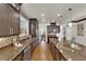 Gourmet kitchen featuring granite counters, stainless appliances, a central island, and seamless access to the breakfast nook at 508 Via Palermo Dr, Henderson, NV 89011