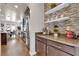 Gourmet kitchen with granite countertops, stainless appliances, mosaic backsplash, and hardwood flooring at 508 Via Palermo Dr, Henderson, NV 89011