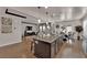 Open concept kitchen with large island, granite countertops, stainless appliances, and seamless access to the living room at 508 Via Palermo Dr, Henderson, NV 89011