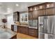 Bright gourmet kitchen with stainless steel appliances, granite countertops, designer backsplash and custom cabinetry at 508 Via Palermo Dr, Henderson, NV 89011