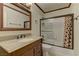 Bathroom featuring a vanity with stone countertop, and shower and tub combination at 5345 Silvermist Ct # 203, Las Vegas, NV 89122