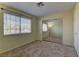 This bedroom features neutral carpet, a window, and a mirrored closet at 5345 Silvermist Ct # 203, Las Vegas, NV 89122