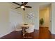Dining room with hardwood floors, a ceiling fan, a round table, and four chairs at 5345 Silvermist Ct # 203, Las Vegas, NV 89122