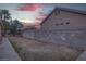 Backyard view of a home with space for landscaping and privacy wall at 5784 Dew Mist Ln, Las Vegas, NV 89110