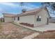 Backyard view of a home with a concrete patio and space for landscaping at 5784 Dew Mist Ln, Las Vegas, NV 89110