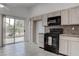 Bright kitchen with sliding glass door leading to the outdoor space at 5784 Dew Mist Ln, Las Vegas, NV 89110