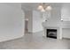 Expansive living area with a fireplace, tile flooring, and abundant natural light at 5784 Dew Mist Ln, Las Vegas, NV 89110