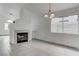 Bright living room featuring a fireplace and tile floors with natural light at 5784 Dew Mist Ln, Las Vegas, NV 89110