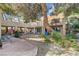 Spacious backyard showing unique architecture, desert landscaping, balconies, and spiral staircase at 5785 N Tee Pee Ln, Las Vegas, NV 89149