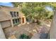 Birds-eye backyard showcasing lush greenery, outdoor seating, and the property's spacious layout at 5785 N Tee Pee Ln, Las Vegas, NV 89149