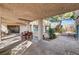 Inviting covered backyard patio with dining and lounge areas, perfect for outdoor living and entertaining at 5785 N Tee Pee Ln, Las Vegas, NV 89149
