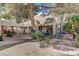 Extensive backyard featuring desert landscaping, unique architecture, balcony, and outdoor dining at 5785 N Tee Pee Ln, Las Vegas, NV 89149
