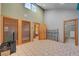 Bedroom with tile floors, view of bathroom and exterior view at 5785 N Tee Pee Ln, Las Vegas, NV 89149