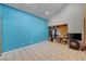 Bedroom with walk in closet, tile floors, and blue wall at 5785 N Tee Pee Ln, Las Vegas, NV 89149