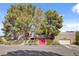 Expansive property showcasing mature trees and unique architectural details at 5785 N Tee Pee Ln, Las Vegas, NV 89149
