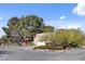 Spacious home featuring desert landscaping and a circular driveway at 5785 N Tee Pee Ln, Las Vegas, NV 89149