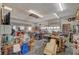 Garage with shelving, work benches and overhead lighting at 5785 N Tee Pee Ln, Las Vegas, NV 89149