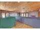 Spacious upstairs hallway featuring wood-beamed ceilings and an open layout at 5785 N Tee Pee Ln, Las Vegas, NV 89149