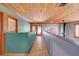 Hallway featuring wood-beamed ceilings and stylish architectural design at 5785 N Tee Pee Ln, Las Vegas, NV 89149