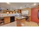 Another view of the kitchen featuring an island, plenty of counter space, and open layout, ideal for everyday living at 5785 N Tee Pee Ln, Las Vegas, NV 89149