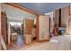 Bright, tiled room with a view into another room with a cozy fireplace and ample storage space at 5785 N Tee Pee Ln, Las Vegas, NV 89149