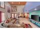Open-concept living room with high ceilings and views into the dining area at 5785 N Tee Pee Ln, Las Vegas, NV 89149