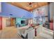 Open living room featuring high ceilings, tiled floors and a fireplace at 5785 N Tee Pee Ln, Las Vegas, NV 89149