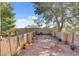 Expansive rooftop patio with seating area, mature trees, and stucco walls create a private outdoor space at 5785 N Tee Pee Ln, Las Vegas, NV 89149