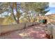 Spacious rooftop patio surrounded by mature trees, connected to the interior via sliding glass doors at 5785 N Tee Pee Ln, Las Vegas, NV 89149