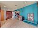Storage room with tile floors, built-in dresser, and turquoise colored walls at 5785 N Tee Pee Ln, Las Vegas, NV 89149