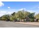 A gated and private desert home with mature landscaping and an attractive street view at 5785 N Tee Pee Ln, Las Vegas, NV 89149