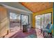 Sun room with floor to ceiling window views of the outside at 5785 N Tee Pee Ln, Las Vegas, NV 89149