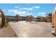 Backyard features a large open space, desert landscaping and privacy wall at 6345 Strongbow Dr, Las Vegas, NV 89156