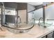Close-up of a bathroom featuring double glass vessel sinks and a sleek countertop at 6345 Strongbow Dr, Las Vegas, NV 89156