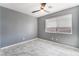 Bedroom featuring gray walls, modern ceiling fan, and ample natural light from a window at 6345 Strongbow Dr, Las Vegas, NV 89156