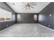 Bright bedroom with neutral walls, tile flooring, and window with blinds at 6345 Strongbow Dr, Las Vegas, NV 89156