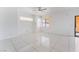 Bright bedroom featuring tile flooring, neutral walls, and natural light from a window at 6345 Strongbow Dr, Las Vegas, NV 89156
