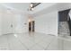 Inviting entryway featuring tiled flooring, a staircase to the second floor, and a modern chandelier at 6345 Strongbow Dr, Las Vegas, NV 89156