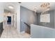Upstairs hallway with decorative light fixtures and access to multiple rooms at 6345 Strongbow Dr, Las Vegas, NV 89156