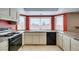 Kitchen featuring cream cabinets, granite countertops, and a large window at 637 Otono Dr, Boulder City, NV 89005