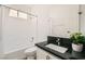 Well-lit bathroom featuring a tub-shower combo and dark countertop vanity at 669 Elliot Peak Ave, Las Vegas, NV 89183
