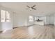 Open-concept living area with wood-look floors and views into the modern kitchen at 669 Elliot Peak Ave, Las Vegas, NV 89183