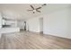 Spacious living area with wood-look flooring leading into a modern kitchen at 669 Elliot Peak Ave, Las Vegas, NV 89183